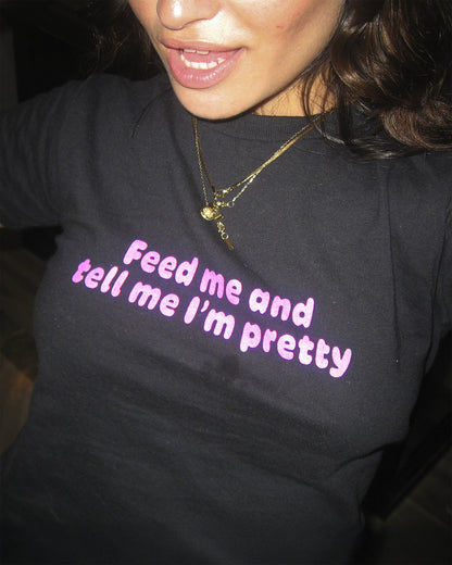 FEED ME AND TELL ME I'M PRETTY